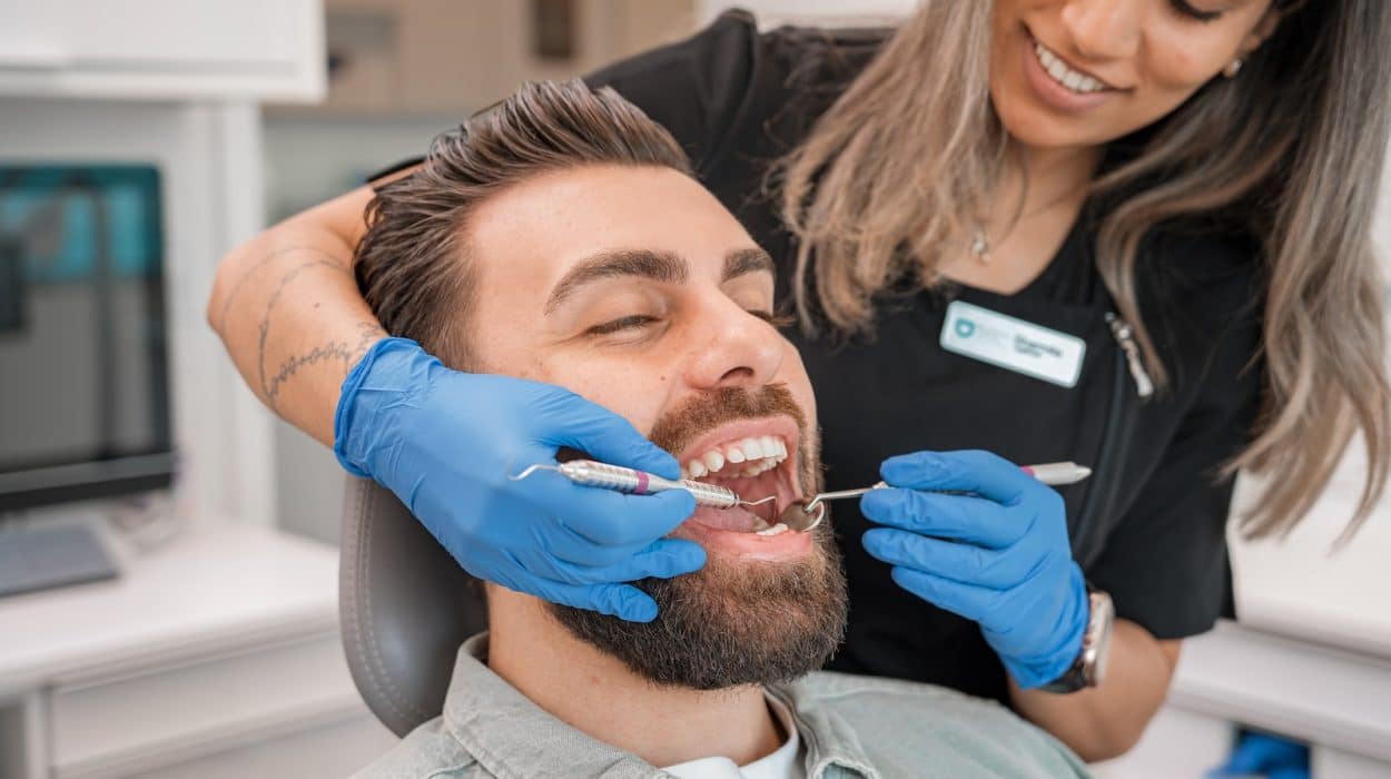 a person brushing a person's teeth